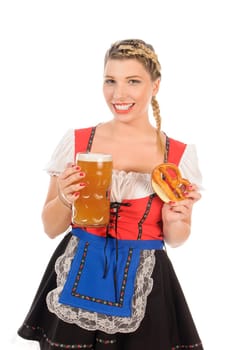 Young attractive woman with blond hair and braids wears a colorful dirdl dress and holds a pretzel and a beer mug with freshly tapped beer in her hand,exposed against a white background.