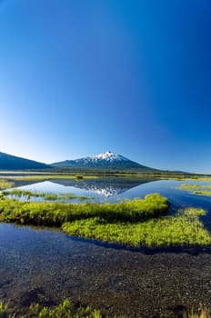 Vertical shot of Mount Bachelor being reflected in Sparks Lake near Bend, Oregon