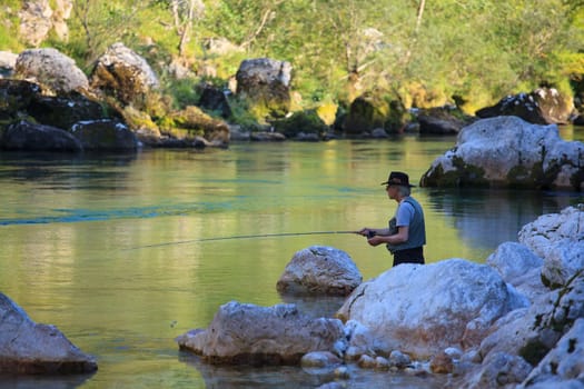 Photo of a Fisherman in the Soca river, Slovenia