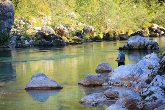 Photo of a Fisherman in the Soca river, Slovenia