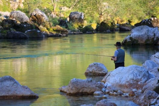 Photo of a Fisherman in the Soca river, Slovenia