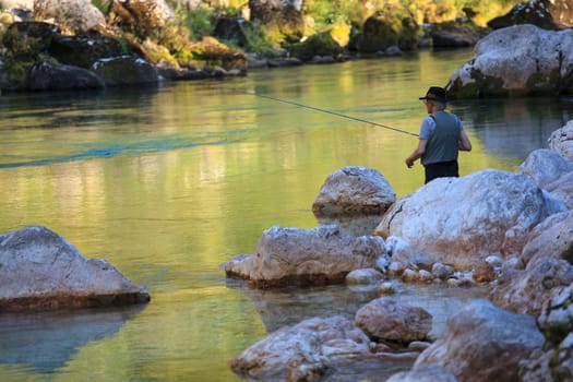 Photo of a Fisherman in the Soca river, Slovenia