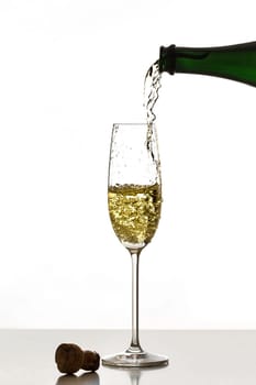 Pour sparkling wine into a glass