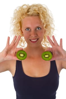 Young woman keeps kiwi halves exposed on a white background
