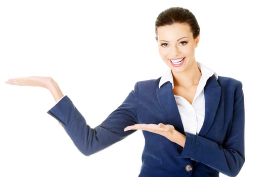 happy young business woman showing copy space on her palm,isolated on white