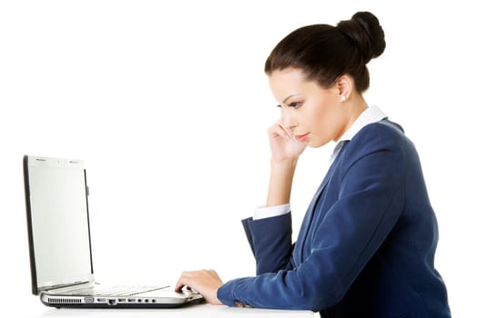 beautiful brunette businesswoman working on laptop computer isolated on white