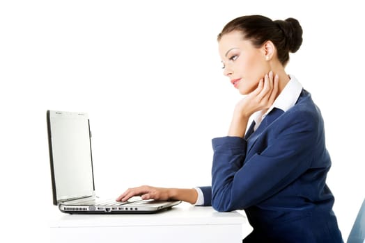beautiful brunette businesswoman working on laptop computer isolated on white