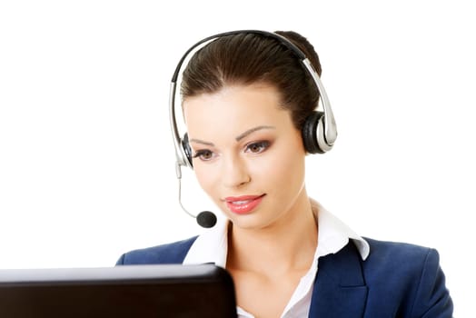 beautiful young call center assistant at the desk,isolated on white