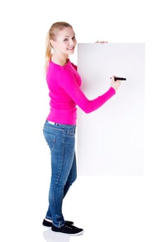 happy beautiful woman writing with a marker on blank board. student or businesswoman.