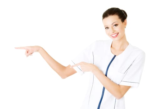 woman doctor or nurse pointing on copy space. isolated on white