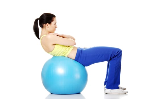 beautiful young healthy lifestyle woman with a pilates exercise ball.