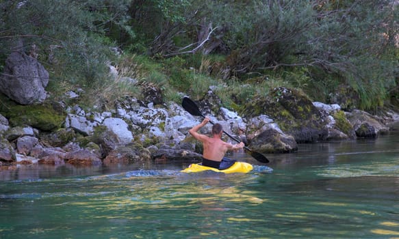 Kayaking in the summer on the Soca river, Slovenia