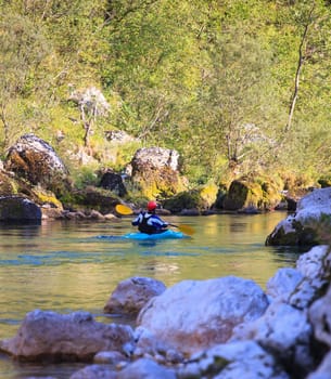 Kayaking in the summer on the Soca river, Slovenia