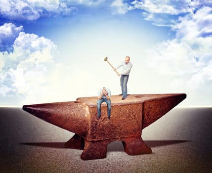 men on iron anvil and sky background