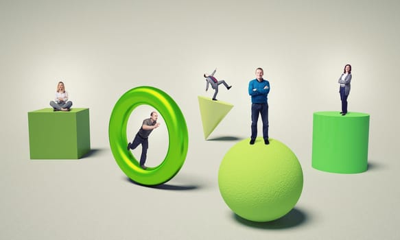 business people on 3d green solid