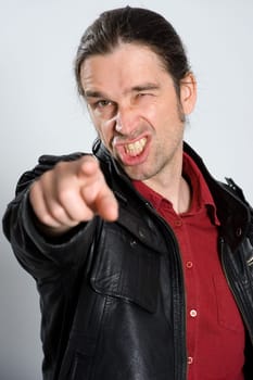 man is pointing in to the camera