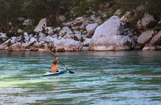 Kayaking in the summer on the Soca river, Slovenia