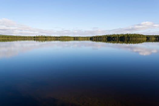 The blue sky is reflected in the lake