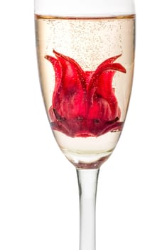 Sparkling wine cocktail with hibiscus blossom