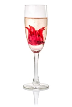 Sparkling wine cocktail with hibiscus blossom