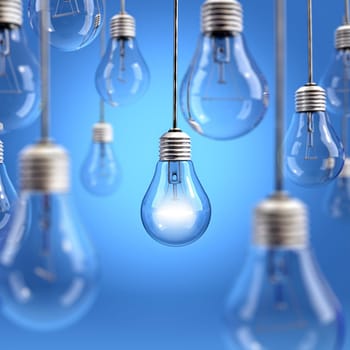 Light bulbs hanging on blue background