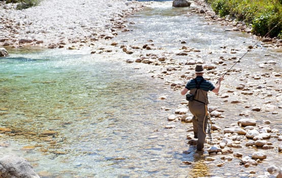 Photo of a Fisherman in the Soca river, Slovenia