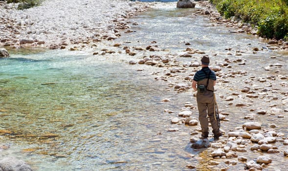 Photo of a Fisherman in the Soca river, Slovenia