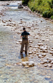 Photo of a Fisherman in the Soca river, Slovenia