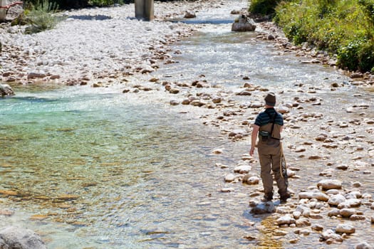 Photo of a Fisherman in the Soca river, Slovenia