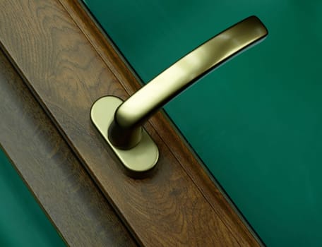 an elegant handle of the wooden door