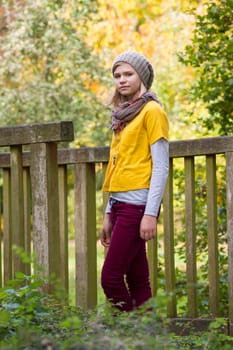young girl in the autumn park