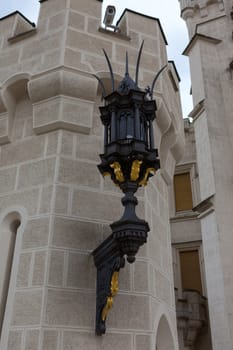 Street lamp on the wall of the castle Hluboka nad Vltavou near Ceske Budejovice, Czech Republic