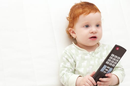 Toddler Baby Watching TV Holding Remote Control