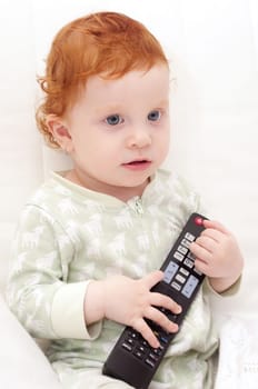 Toddler Baby Watching TV Holding Remote Control