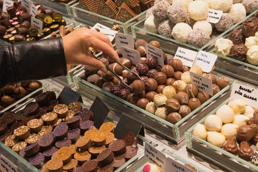 Buying chocolate truffles on the market