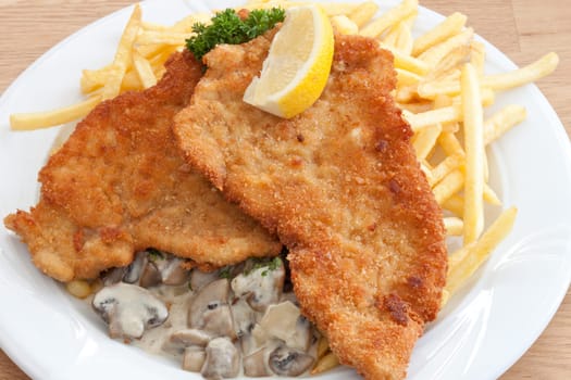 Pork schnitzel Viennese style with fries