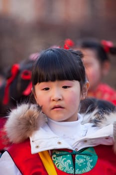 MILAN, ITALY - FEBRUARY 10, 2013: Child during Chinese New Year parade in Milan