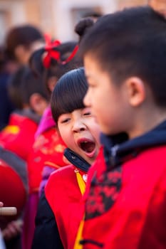 MILAN, ITALY - FEBRUARY 10, 2013: Child during Chinese New Year parade in Milan
