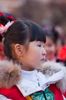 MILAN, ITALY - FEBRUARY 10, 2013: Child during Chinese New Year parade in Milan