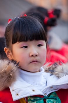 MILAN, ITALY - FEBRUARY 10, 2013: Child during Chinese New Year parade in Milan