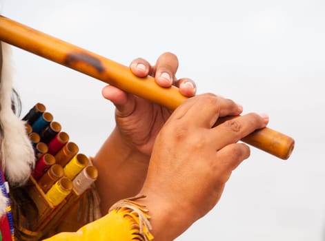 Peruvian Man In Native Costume Playing flute