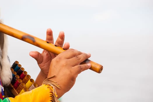Peruvian Man In Native Costume Playing flute