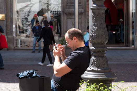 Man using the smartphone, Milan - Italy