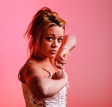 Sensual blonde girl on pink background