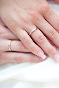 The bride and groom's hands together