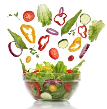 Falling fresh vegetables. Healthy salad isolated
