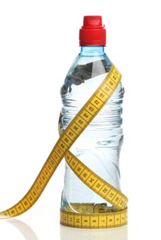 Bottle with water and a measuring tape isolated