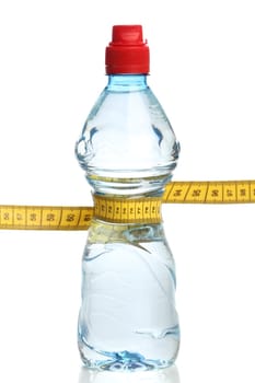 Bottle with water and a measuring tape isolated