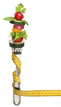Mixed vegetables on a fork isolated. Diet concept
