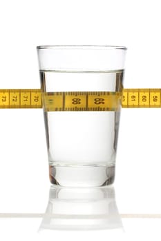 Glass of water and a measuring tape